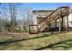 Spacious backyard featuring a multilevel deck and a well-maintained lawn offering endless possibilities for outdoor activities at 4312 Daniel Dr, Winston, GA 30187