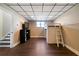 Spacious basement with a ceiling grid, finished floor, and a bonus area with a bunk bed at 4312 Daniel Dr, Winston, GA 30187