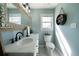 Elegant bathroom featuring double sinks, a large mirror, and modern fixtures at 4312 Daniel Dr, Winston, GA 30187