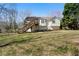 Lovely home exterior with a deck overlooking a backyard, blending charm and outdoor enjoyment in a peaceful setting at 4312 Daniel Dr, Winston, GA 30187