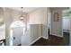 Bright foyer with hardwood floors and modern lighting fixture at 4312 Daniel Dr, Winston, GA 30187