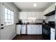 Kitchen with stainless steel appliances, subway tile, and access to the back porch at 4312 Daniel Dr, Winston, GA 30187