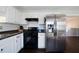 The kitchen features white cabinets, a stainless steel refrigerator, and a black gas range oven at 4312 Daniel Dr, Winston, GA 30187