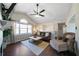 Inviting living room featuring a fireplace, comfortable seating, and ample natural light at 4312 Daniel Dr, Winston, GA 30187