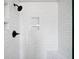 Modern shower with white subway tile and dark fixtures at 4312 Daniel Dr, Winston, GA 30187