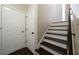 Staircase with dark wood treads and white risers leading to the upper level at 4312 Daniel Dr, Winston, GA 30187