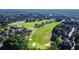 A sprawling golf course is adjacent to an upscale residential neighborhood at 4827 Basingstoke Dr, Suwanee, GA 30024