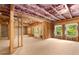 Unfinished basement space showcasing framing, natural light, and potential for customization at 4827 Basingstoke Dr, Suwanee, GA 30024