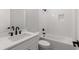 Bathroom featuring modern fixtures, neutral color palette, and a sleek tub/shower combination at 4827 Basingstoke Dr, Suwanee, GA 30024