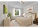 Cozy bedroom with neutral colors and a large window at 4827 Basingstoke Dr, Suwanee, GA 30024