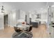 Open-concept kitchen and dining area with stainless steel appliances and a spacious island at 4827 Basingstoke Dr, Suwanee, GA 30024