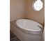Relaxing soaking tub near a window, perfect for unwinding at 59 Pine Ridge Ln, White, GA 30184