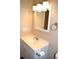 Bathroom with a white vanity, updated lighting, and clean finishes at 59 Pine Ridge Ln, White, GA 30184