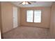 Bedroom with neutral carpet and dual windows at 59 Pine Ridge Ln, White, GA 30184