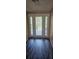 Entryway with decorative front door and gray wood-look floors at 59 Pine Ridge Ln, White, GA 30184
