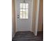 Entryway features a white door with glass insert and neutral walls at 59 Pine Ridge Ln, White, GA 30184