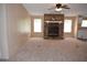 Spacious living room featuring a stone fireplace and large windows for natural light at 59 Pine Ridge Ln, White, GA 30184