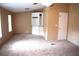 Bright living room with plush carpeting, storage and a neutral color palette at 59 Pine Ridge Ln, White, GA 30184