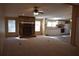 Inviting living room with a stone fireplace, ceiling fan, and lots of natural light at 59 Pine Ridge Ln, White, GA 30184