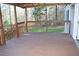 View of the spacious covered porch overlooking a grassy yard at 59 Pine Ridge Ln, White, GA 30184