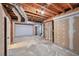 Unfinished basement with open ceilings and some wall framing and concrete floor at 1095 Willow Bnd, Roswell, GA 30075