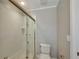 Bright bathroom features a shower with glass doors and white toilet at 1095 Willow Bnd, Roswell, GA 30075