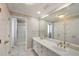 Well-lit bathroom features double sinks, a large mirror, and a separate shower, providing convenience and style at 1095 Willow Bnd, Roswell, GA 30075