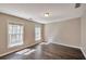 Serene bedroom offers natural light, hardwood floors, and neutral paint, creating a peaceful retreat at 1095 Willow Bnd, Roswell, GA 30075