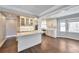 Modern kitchen with white cabinets, marble countertops, stainless steel appliances, and hardwood floors at 1095 Willow Bnd, Roswell, GA 30075