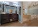 Elegant bathroom boasts a large vanity, glass shower, and stylish design at 1527 Ridgewood Sw Dr, Lilburn, GA 30047