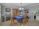 Elegant dining room with a table set for a meal and wine storage at 1527 Ridgewood Sw Dr, Lilburn, GA 30047