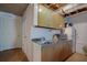 Kitchenette area featuring sink, cabinetry, and microwave at 1527 Ridgewood Sw Dr, Lilburn, GA 30047