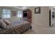 Comfortable main bedroom with plush carpeting, soft lighting, and ample closet space at 1527 Ridgewood Sw Dr, Lilburn, GA 30047