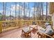 Inviting wooden deck featuring comfortable outdoor seating and scenic backyard views at 1904 Rosewood Ln, Woodstock, GA 30189