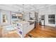 Bright, open kitchen featuring a stainless steel fridge, double ovens, and hardwood floors at 1904 Rosewood Ln, Woodstock, GA 30189