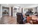 Comfortable living room with a kitchenette, leather recliners, and hardwood floors at 1904 Rosewood Ln, Woodstock, GA 30189