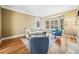 Cozy living room with a bay window, hardwood floors, and comfortable seating for relaxing evenings at 1904 Rosewood Ln, Woodstock, GA 30189