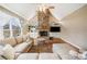 Bright living room featuring a stone fireplace, built-in shelving, and vaulted ceilings for a spacious feel at 1904 Rosewood Ln, Woodstock, GA 30189