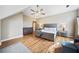 Large main bedroom with hardwood floors, sitting area, vaulted ceilings, and neutral walls at 1904 Rosewood Ln, Woodstock, GA 30189