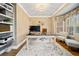 A home office with hardwood floors, a neutral rug, and a large window providing natural light at 1904 Rosewood Ln, Woodstock, GA 30189