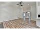 Bright living room with wood floors, high ceilings, and a view of the entryway at 3535 Southmont Ct, Cumming, GA 30041