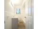 Bathroom featuring a tiled shower-tub, sink vanity, and natural light at 610 Walnut Sw Pl, Marietta, GA 30060