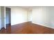 Bedroom featuring wainscoting, hardwood floors, and a closet at 610 Walnut Sw Pl, Marietta, GA 30060