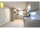 Well-lit kitchen with gray cabinets, granite countertops, and stainless steel appliances at 610 Walnut Sw Pl, Marietta, GA 30060