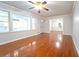 Spacious living room with gleaming hardwood floors and a ceiling fan at 610 Walnut Sw Pl, Marietta, GA 30060