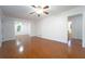 Inviting living room with hardwood floors, ceiling fan, and an open doorway to other rooms at 610 Walnut Sw Pl, Marietta, GA 30060