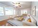 Bright and airy living room featuring hardwood floors, a ceiling fan, and a view to the dining room at 610 Walnut Sw Pl, Marietta, GA 30060