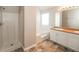 Bright bathroom complete with shower, soaking tub, and dual sink vanity at 6251 Lamp Post Pl, Atlanta, GA 30349