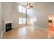 Inviting living room with fireplace, high ceilings, and hardwood flooring at 6251 Lamp Post Pl, Atlanta, GA 30349