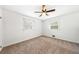 Inviting bedroom with plush carpeting, a ceiling fan, and two windows that provide plenty of natural light at 801 N Evelyn Nw, Atlanta, GA 30318